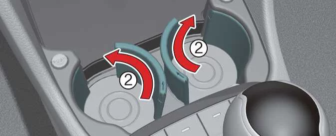 Rotating the Kia Picanto cup holder section to create storage space