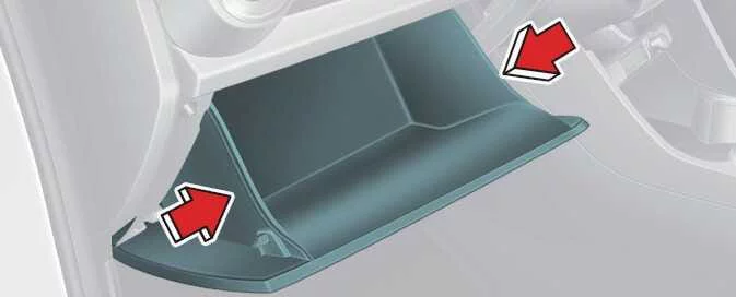 Glove box sides being pressed inward to lower the Kia Picanto glove box
