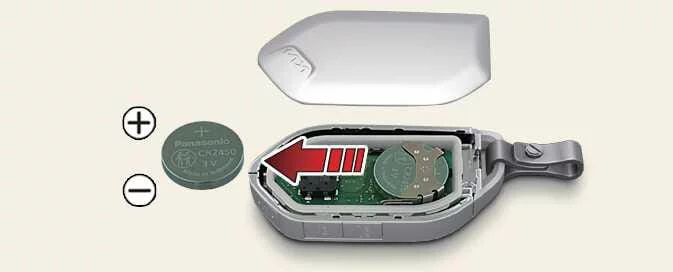 Kia Picanto smart key battery replacement showing the opened housing and battery position