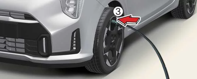 Connecting the Kia Picanto Tyre Mobility Kit filling hose to the tyre valve