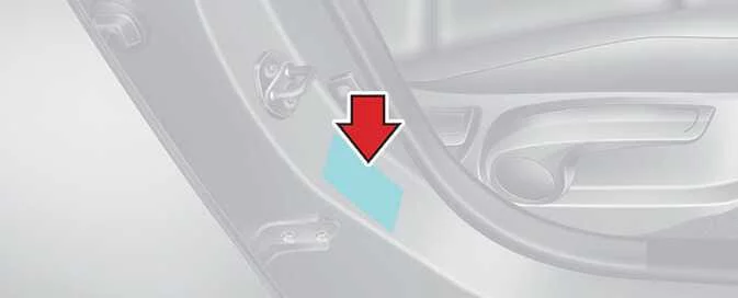 Kia Picanto vehicle certification label on the centre pillar displaying the vehicle identification number